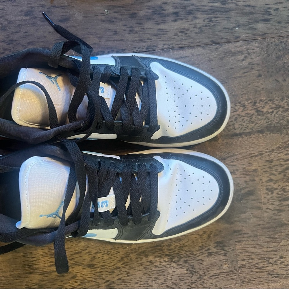 Jordan’s Black and White Sneakers with Blue Accents